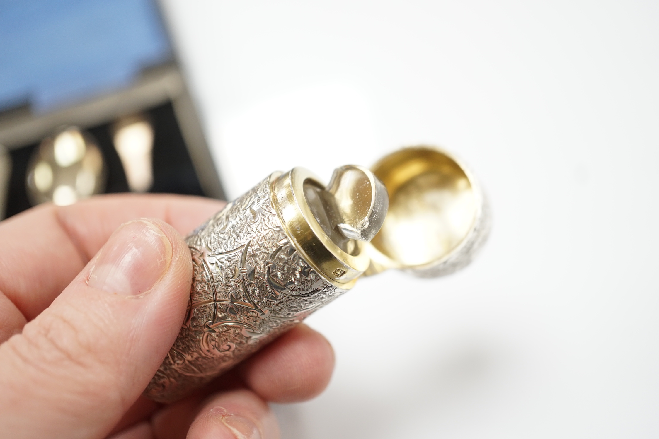 A late Victorian engraved silver cylindrical scent bottle, by Sampson Mordan & Co, London, 1882, 53mm, together with a later set of six silver coffee spoons.